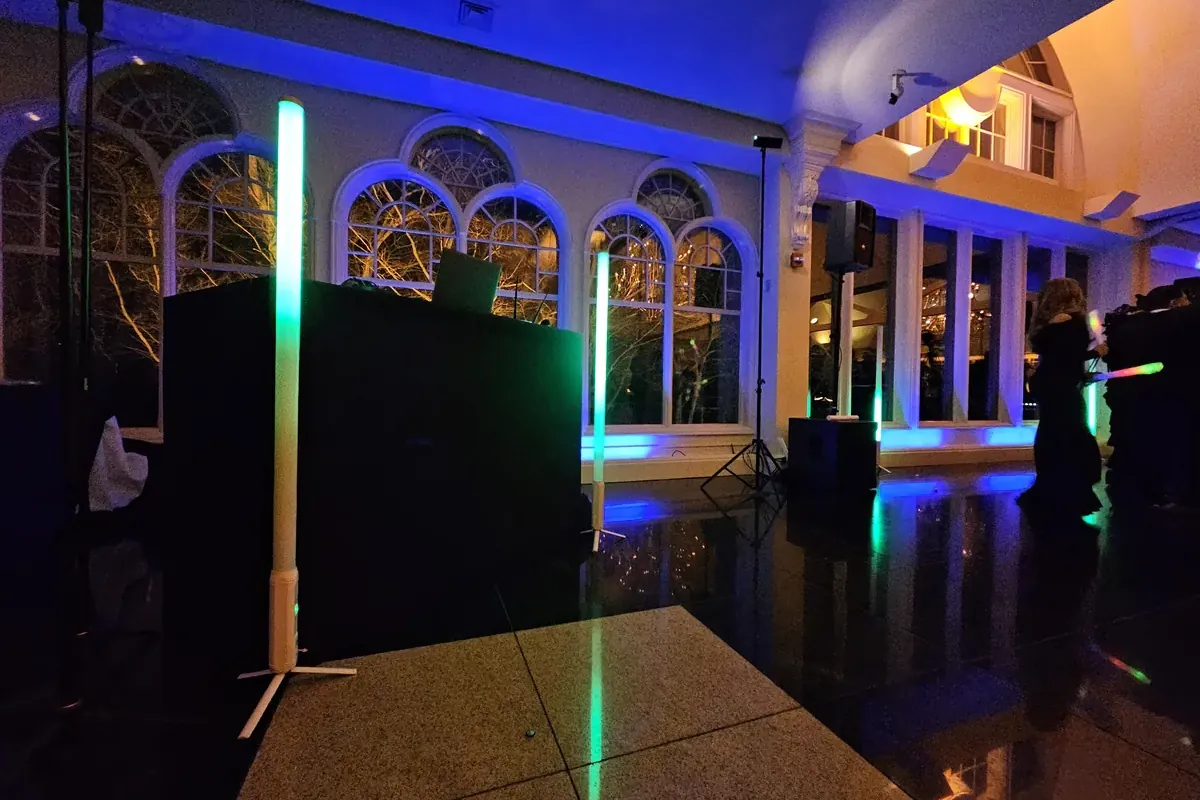 Michael Sage's DJ booth and music-driven lighting set up in a ballroom