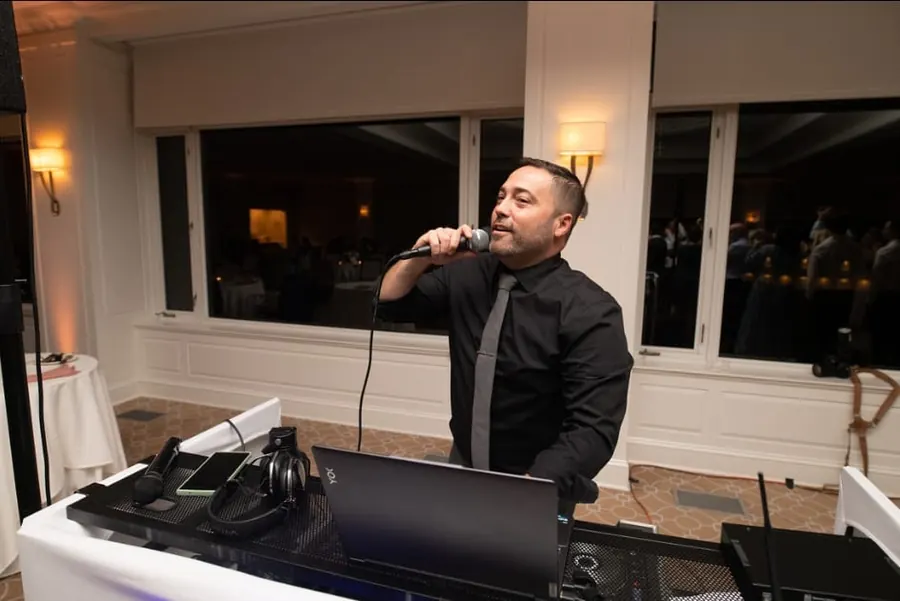 Michael Sage on the microphone at his DJ booth
