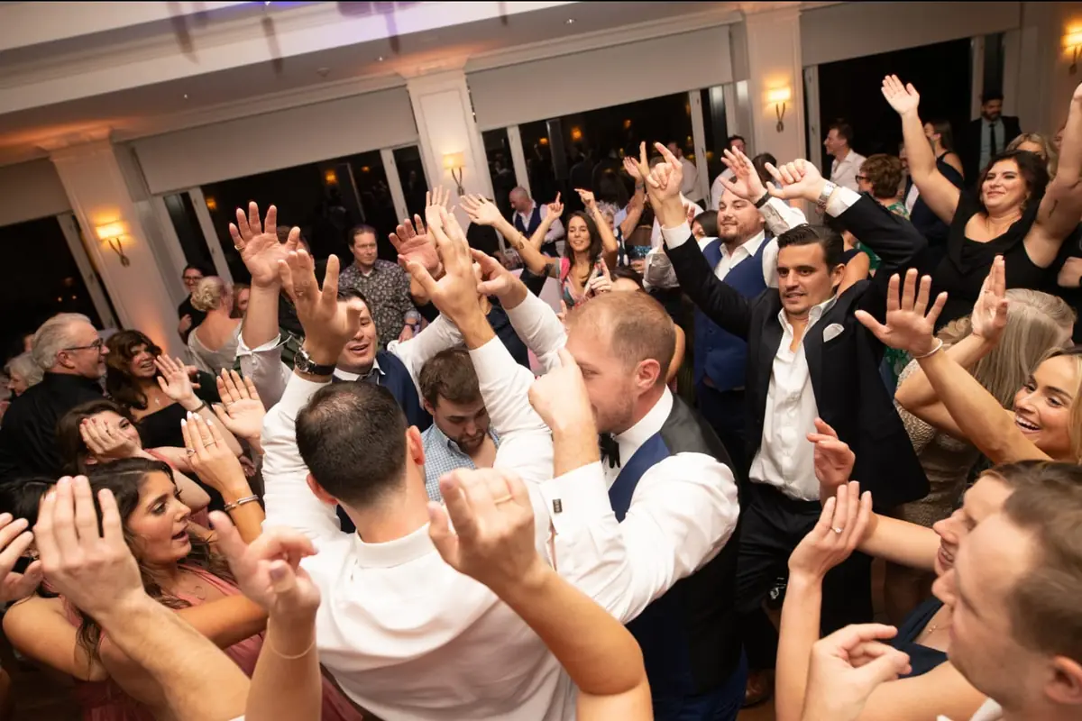 Reception room with Michael Sage uplighting and DJ setup