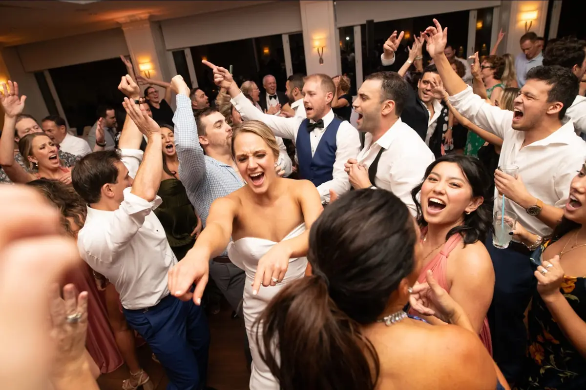 Wedding guests dancing during a Michael Sage reception